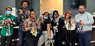 Navy Federal employees use old T-shirts to make tug toys for service dogs.