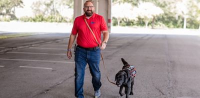Mike Drafts of K9s For Warriors learns to handle his new service dog, GiGi.