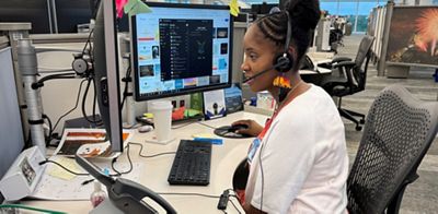 Jalissa supports members at her desk at Navy Federal’s Pensacola campus.