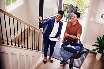 Realtor and client looking over new home open house