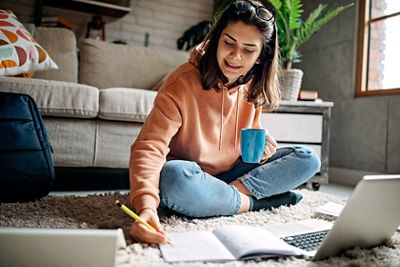 Young woman using laptop to learn online