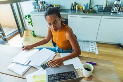 Beautiful woman freelancer is occupied by remote work