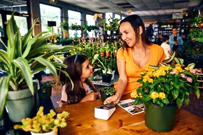 Mother and daughter purchasing plants at Garden Center