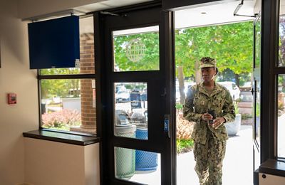 Servicemember walking into a branch.