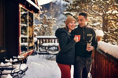 Couple enjoying their morning coffee on their winter vacation