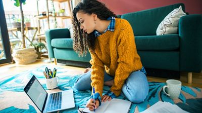 Woman working online from her living room